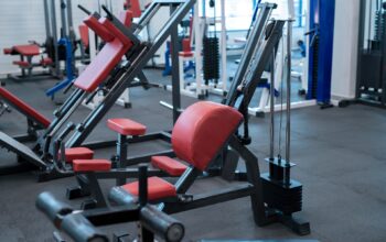 Background image of modern gym interior with exercise machines, copy space